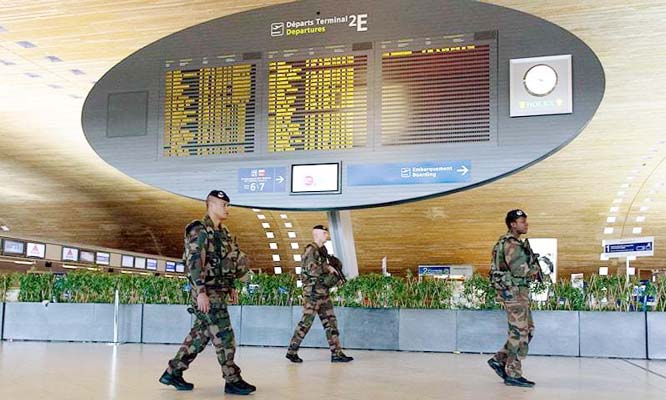 French soldiers patrol the Terminal 2E of the Paris-Charles-de-Gaulle airport on Sunday in Roissy-en-France, north of Paris.