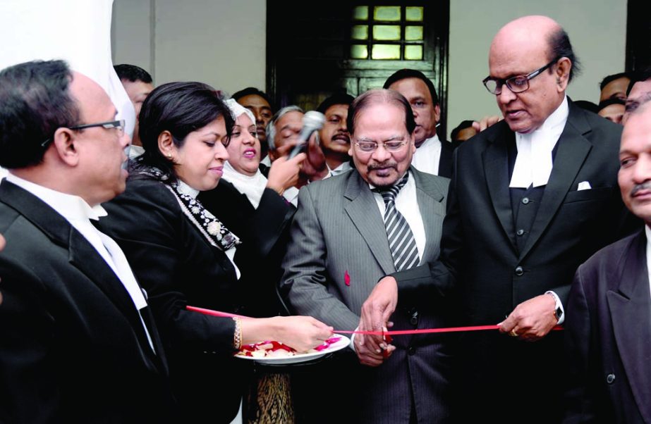 Justice Syed Dastagir Hossain inaugurating a 7-day long book fair organised by the Supreme Court Bar Association at the Supreme Court premises on Sunday by cutting ribbon.