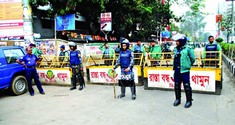 Law enforcers put on barricade at Kakoli entrance in Banani for security measures. The snap was taken on Sunday.