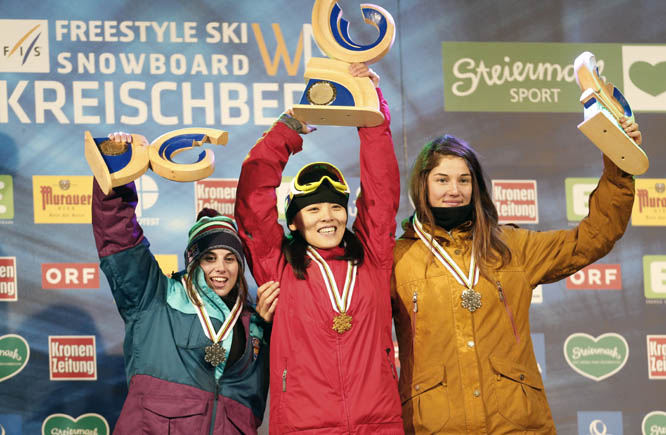 China's Xeutong Cai (center) celebrates her victory with runner up, Spain's Queralt Castellet (left) and third placed France's Clemence Grimal following the snowboard half pipe final event at the Freestyle Ski and Snowboard World Championships in Kreis