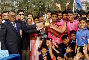 Air Officer Commanding of BAF Base Bashar and Chairman of BAF Shaheen School & College Governing Body Air Vice Marshal M Naim Hassan giving away the trophy to Issa Khan House, which emerged the champions of the Inter-House Annual Sports Competition-2015 o