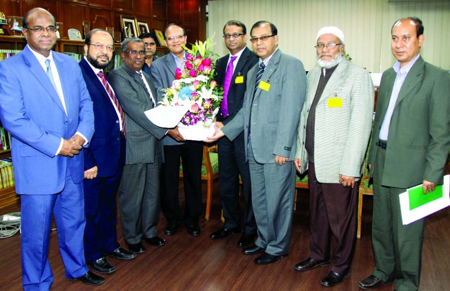 Mohammed Nurul Amin, Chairman of Bangladesh Foreign Exchange Dealers' Association and Managing Director of Meghna Bank Limited, along with a delegation greet Bangladesh Bank Governor Dr Atiur Rahman at BB office on Monday for winning the best Central Ban