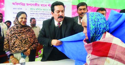 RANGPUR: State Minister for Local Government, Rural Development and Cooperative Alhaj Mashiur Rahman Ranga MP distributing blankets among cold-hit people in Gangachara Upazila on Sunday.