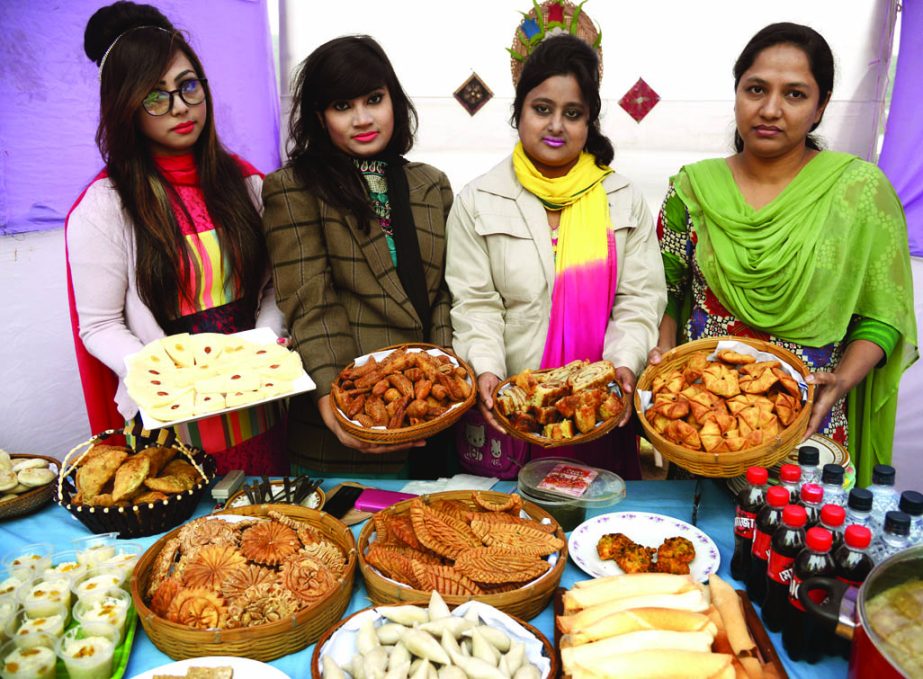 â€˜Jatiya Pitha Utsab Udjapon Parishad' organised a National Cake Festival-2015 at the Shilpakala Academy premises in the city on Monday. Organisers seen at a stall of the festival.
