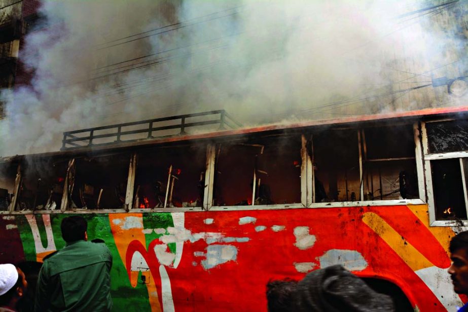 A passenger bus was torched by the blockaders near Modhumita Cinema Hall at Motijheel in Monday.