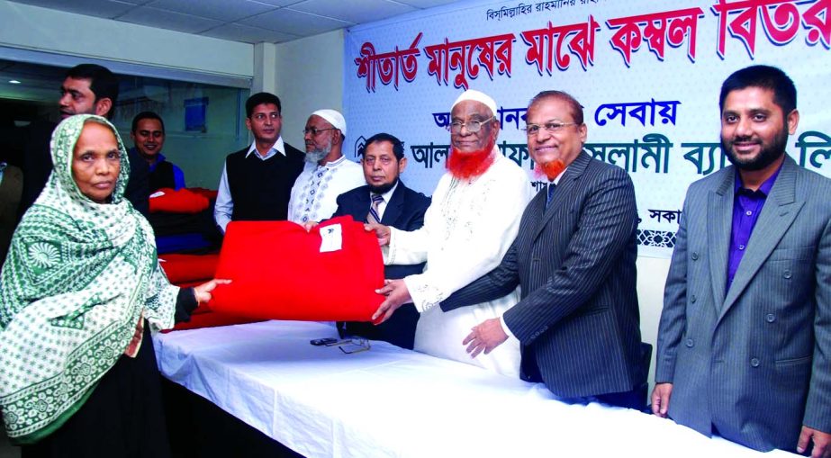 Alhajj Abdul Malek Mollah, Director of Al-Arafah Islami Bank Limited, distributing blankets among the cold-hit destitute of Khilkhet area recently. DMD Md Mofazzal Hossain and Head of AIBL Dhaka North Zone Manir Ahmad were present. Khilkhet branch manage