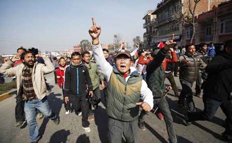 Nepalese protesters shout slogans against the government during the general strike by Communist Party of Nepal (CPN-Maoist) in Kathmandu, Nepal on Tuesday.