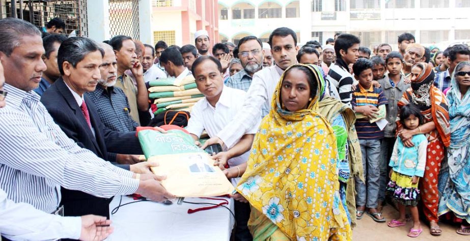 CDA Chairman Abdus Salam distributing blankets among the cold-hit people on behalf of Mabia Rashidia Foundation at Ward No 7 in the city yesterday.