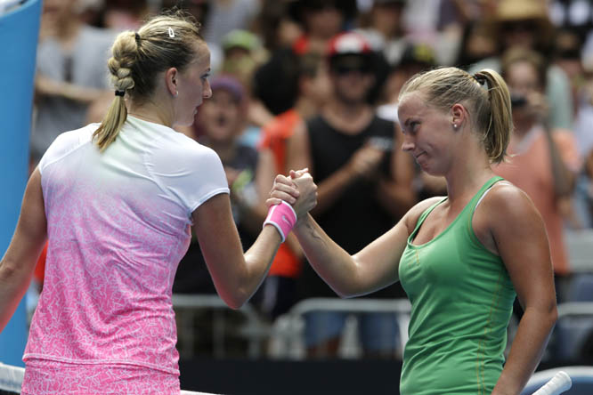 Petra Kvitova of the Czech Republic (left) is congratulated by Richel Hogenkamp of the Netherlands after winning their first round match at the Australian Open tennis championship in Melbourne, Australia on Tuesday.