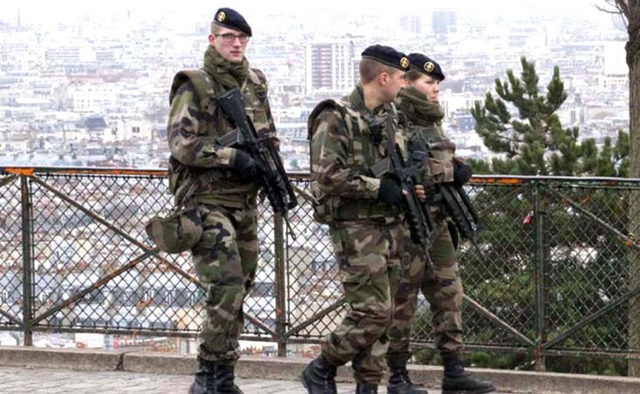 French soldiers patrol on the streets of Paris.