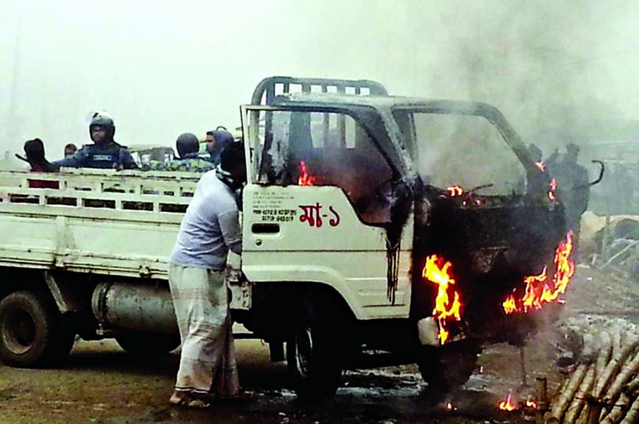 Picketers set fire a truck carrying police during hartal. The snap was taken from Konabari area in Gazipur on Wednesday.