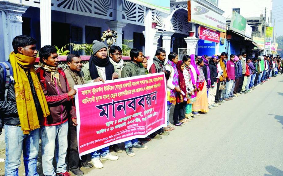 DINAJPUR: Six organisation formed a human chain demanding arrest of the killers of tribal youth Bublu Hembrom, leader of Santal Students' Forum(Sasu), Ranjshahi City Unit at Dinajpur Press Club yesterday.