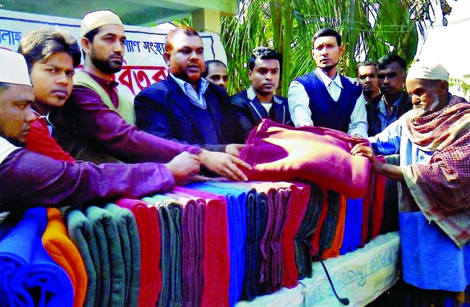 SYLHET: Nizam Uddin, Chairman , Bishwnath distributing blankets among the cold hit people of the upazila recently.