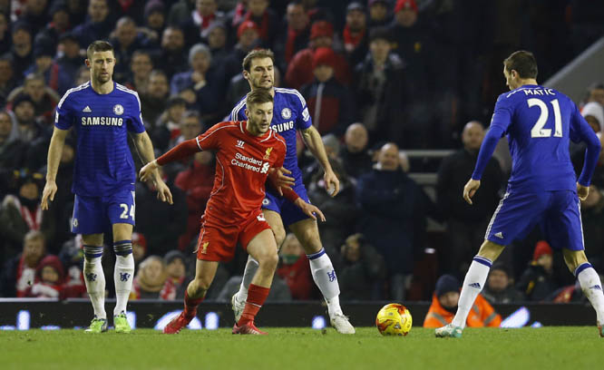 Liverpool's Adam Lallana (second left) competes for the ball with Chelsea's Nemanja Matic (right) during the English League Cup semi-final first leg soccer match between Liverpool and Chelsea at Anfield Stadium, Liverpool, England on Tuesday.
