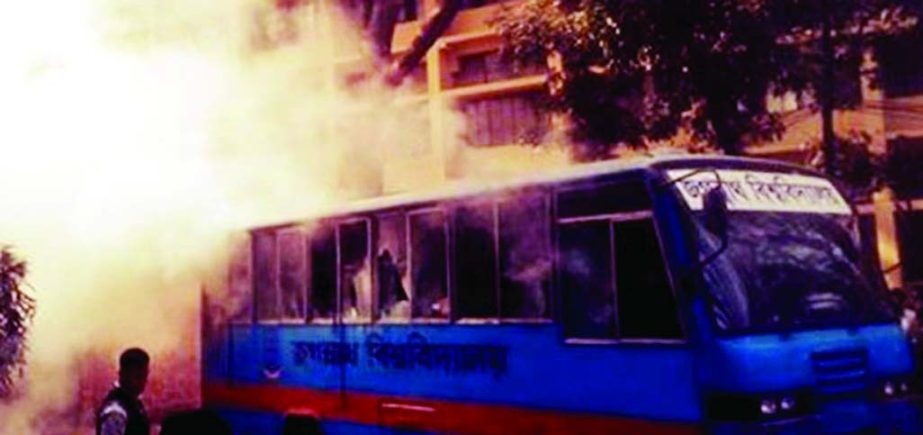 Hartal supporters set afire a bus of Jagannath University on Wednesday on the first day of 48-hour hartal enforced by 20-party alliance.