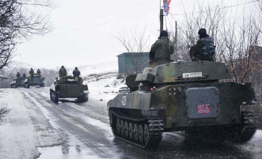 A pro-Russian armored vehicle moves toward Slovyanoserbsk, eastern Ukraine, on Wednesday.