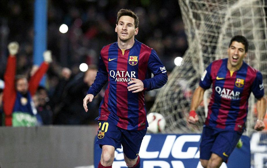 Messi (left) is followed by team-mate Luis Suarez as the Catalans show relief at finally breaking Atletico's resistance during a Copa del Rey Quarterfinal soccer match between FC Barcelona and Atletico Madrid at the Camp Nou stadium in Barcelona, Spain o