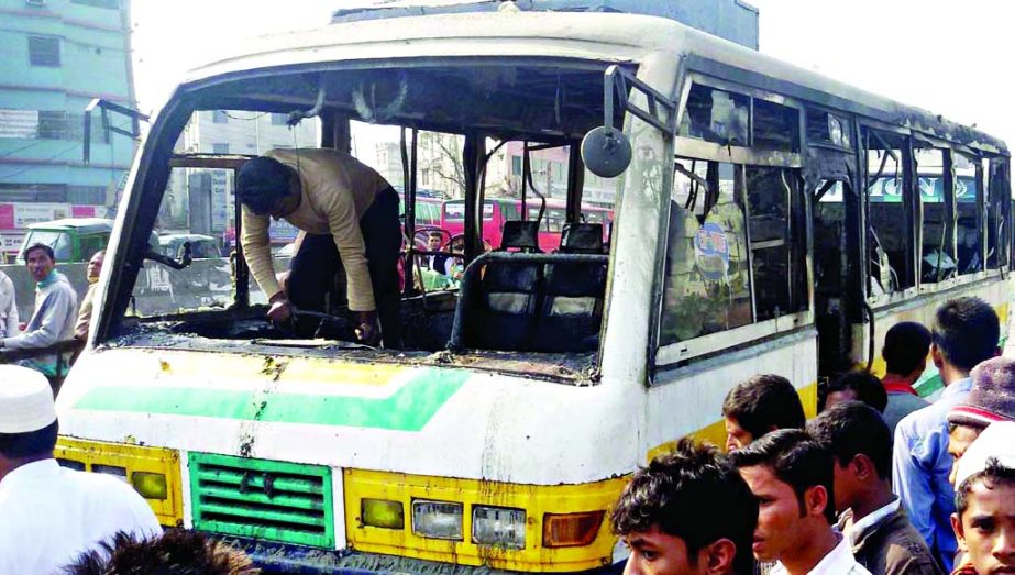 Blockaders torched a bus in city's Shanir Akhra area on Friday.