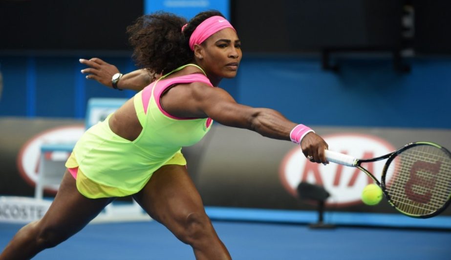 Serena Williams of the US stretches to hit a return to Elina Svitolina of Ukraine during their women's singles third round match at the Australian Open 2015 tennis tournament in Melbourne on Saturday.