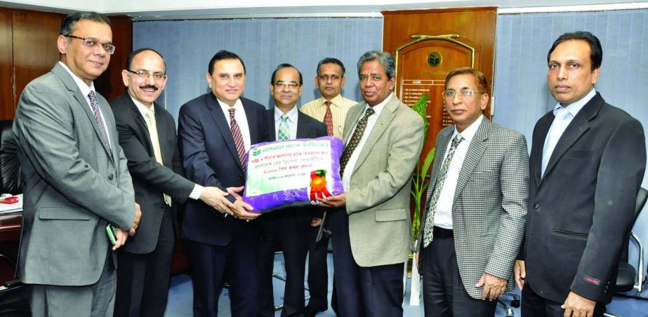 Shamsul Huda Khan, Managing Director of National Bank Limited, handing over blankets to BMM Mozharul Haq, Secretary General of Bangladesh Red Crescent Society recently for distributing among the cold-hit poor.