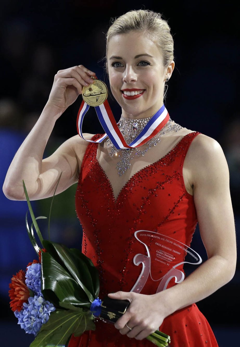 Ashley Wagner holds her medal during the awards ceremony after winning the women's competition in the U.S. Figure Skating Championships in Greensboro, N.C. on Saturday.