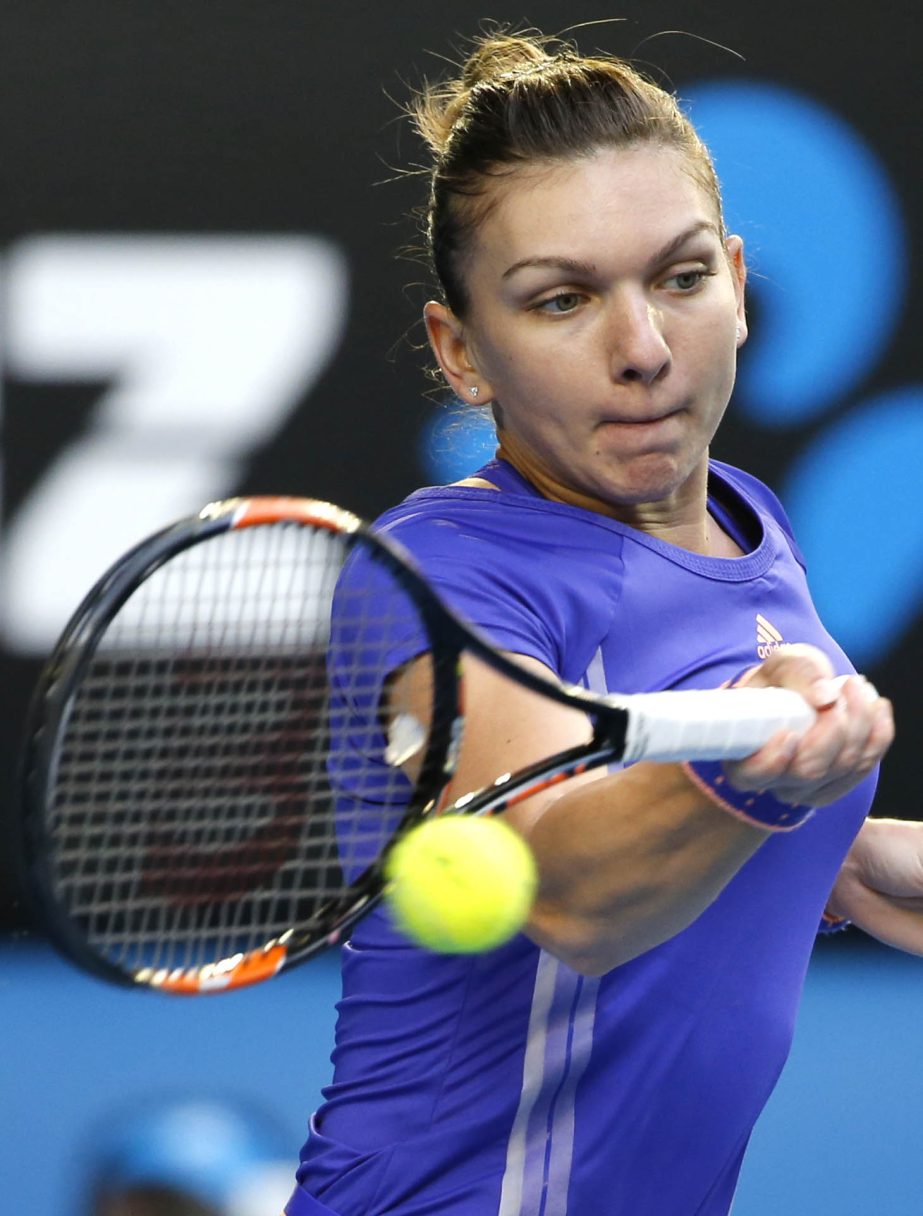 Simona Halep of Romania makes a forehand return to Yanina Wickmayer of Belgium during their fourth round match at the Australian Open tennis championship in Melbourne, Australia on Sunday.
