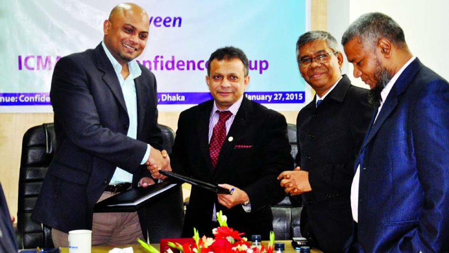 Mohammed Salim FCMA, President of the Institute of Cost and Management Accountants of Bangladesh and Imran Karim, Managing Director of Confidence Group, exchanging documents of Memorandum of Understanding on technical and strategic cooperation in various