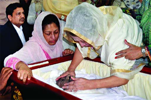 Tears of pain and love: Begum Khaleda Zia broke down over the body of her younger son Arafat Rahman Koko when he was brought to her Gulshan office from Malaysia on Tuesday. Wife of Arafat is also seen beside her.