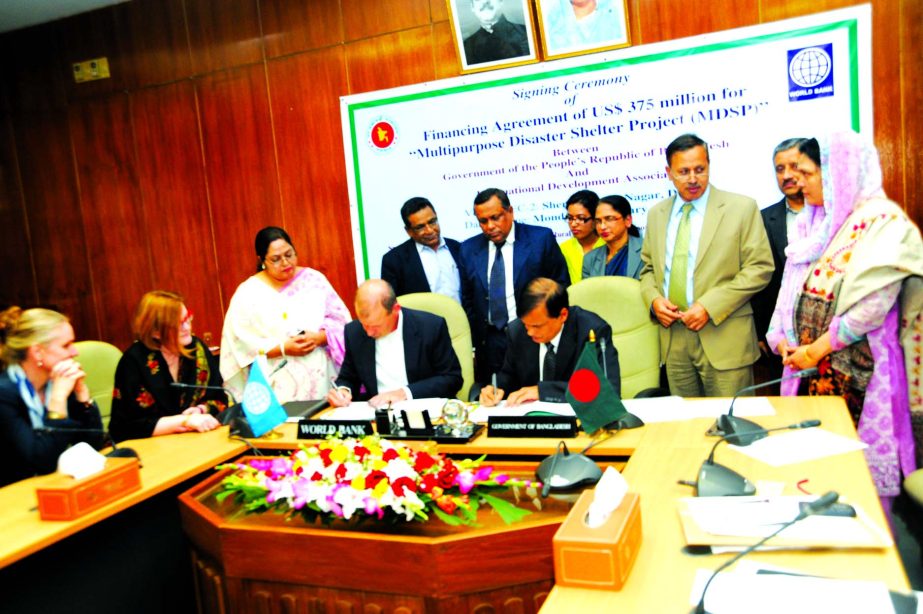 Mohammad Mejbahuddin, Senior Secretary of Economic Relations Division and Johannes Zutt, Country Director of World Bank, Dhaka office signing for US$375 million loan agreement at ERD on Monday to implement the Multipurpose Disaster Shelter Project. Abul K