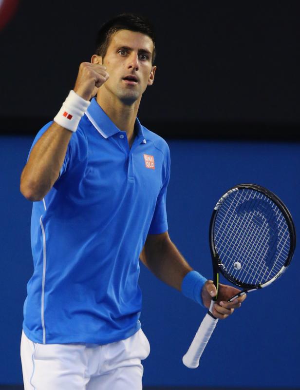 Novak Djokovic of Serbia celebrates as he wins the first set in his quarter final match against Milos Raonic of Canada during day 10 of the 2015 Australian Open at Melbourne Park in Melbourne, Australia on Wednesday.