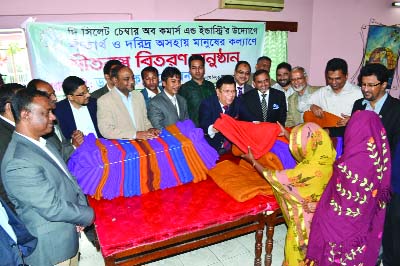 SYLHET: Dr AKA Momen, Permanent Representative to Bangladesh in UN and members of Sylhet Chamber of Commerce and Industry distributing blankets among cold -hit people in Sylhet recently.