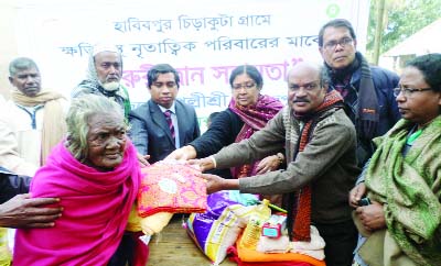 DINAJPUR: Blankets were distributed among tribal people of Chirkuta village in Parbotipur Upazila organised by NGO Palli Sree yesterday. .