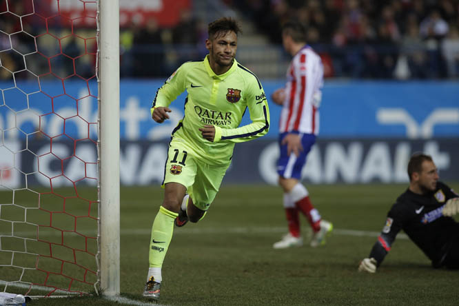 Barcelona's Neymar (left) celebrates his second goal during a second leg quarterfinal Copa del Rey soccer match between Atletico de Madrid and FC Barcelona at the Vicente Calderon stadium in Madrid, Spain on Wednesday.