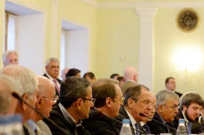 Russia's Foreign Affairs Minister Sergey Lavrov (4thR) speaks during talks between representatives of the Syrian government and the Syrian opposition in Moscow.