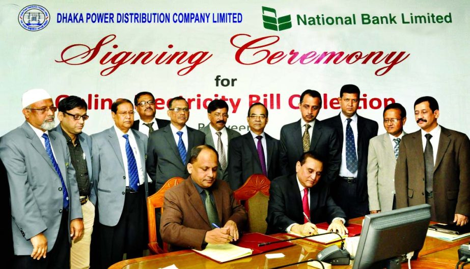 Shamsul Huda Khan, Managing Director of National Bank Ltd and Md Munir Chowdhury, Company Secretary of Dhaka Power Distribution Company sign a Memorandum of Understanding to serve the electricity bill through online for Dhaka and Narayanganj customers re