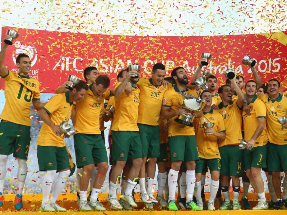 The Socceroos celebrate with the Asian Cup trophy after beating South Korea 2-1 in the final at Stadium Australia in Sydney on Saturday.