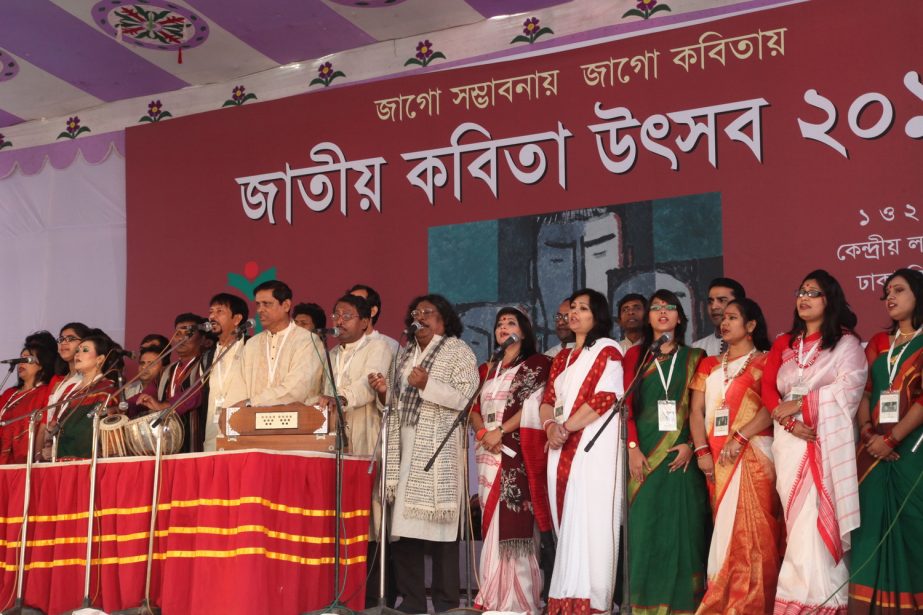 Singers performing a chorus song at the opening ceremony of Jatiyo Kobita Utsab on the Central Public Library premises in the cityâ€™s Shahbagh area on Sunday.