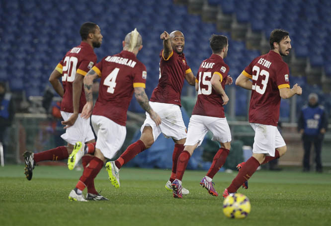 Roma's Maicon (center) celebrates with his teammates after he scored during a Serie A soccer match between Roma and Empoli at Rome's Olympic Stadium on Saturday.