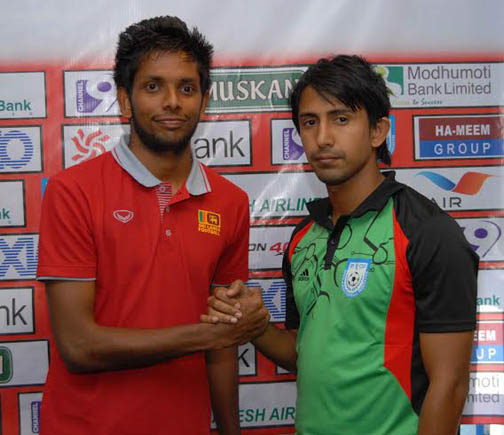 Captain of Bangladesh National Football team Mamunul Islam (right) and Captain of Sri Lanka National Football team Sujon Perera (left) shaking hands at the Bangladesh Football Federation House on Sunday.