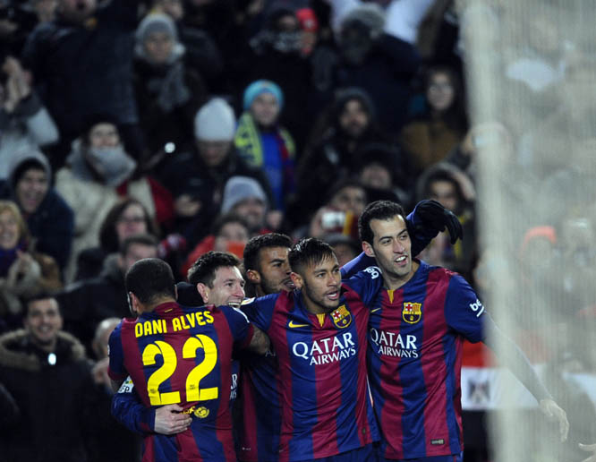 FC Barcelona's Lionel Messi, from Argentina (second left) reacts after scoring with his teammates against Villarreal during a Spanish La Liga soccer match at the Camp Nou stadium in Barcelona, Spain on Sunday.