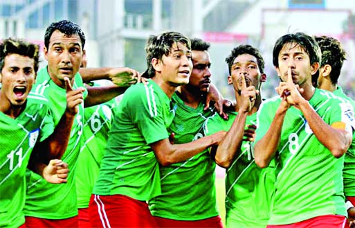 Players of Bangladesh National Football team celebrating victory over Sri Lanka at the Bangabandhu National Stadium on Monday.