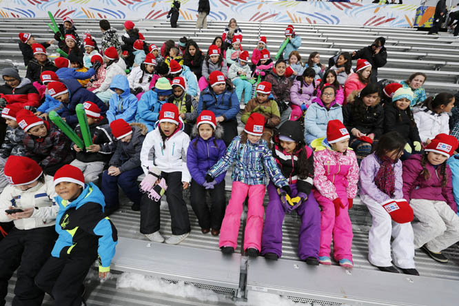 Students wait in the stands in the finish area of the World Cup Championship Skiing course on Monday in Beaver Creek, Colo. The women's first downhill training run was postponed and may be cancelled because of new snowfall on the course.