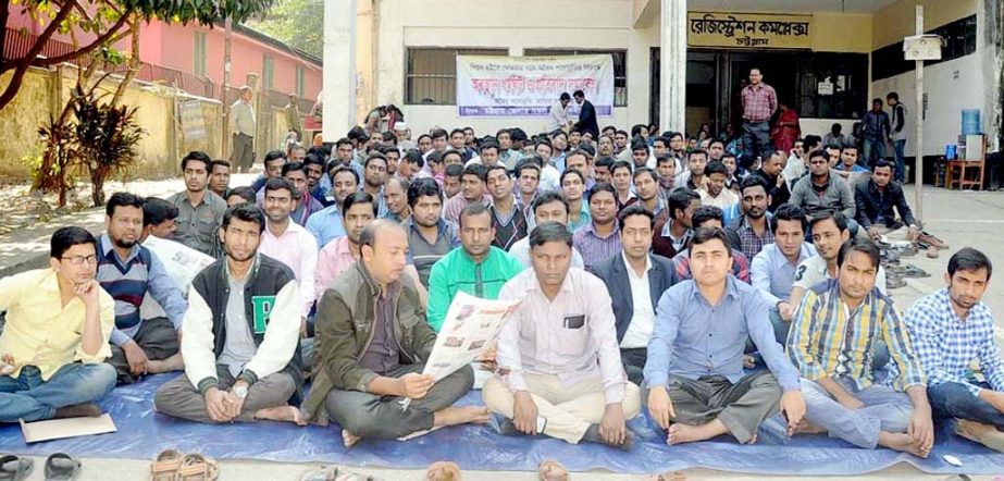 Copyists (Mohrar) of Chittagong district registry office observed sit-in programme to press home their demands including promotion of peon to Mohorar posts yesterday.