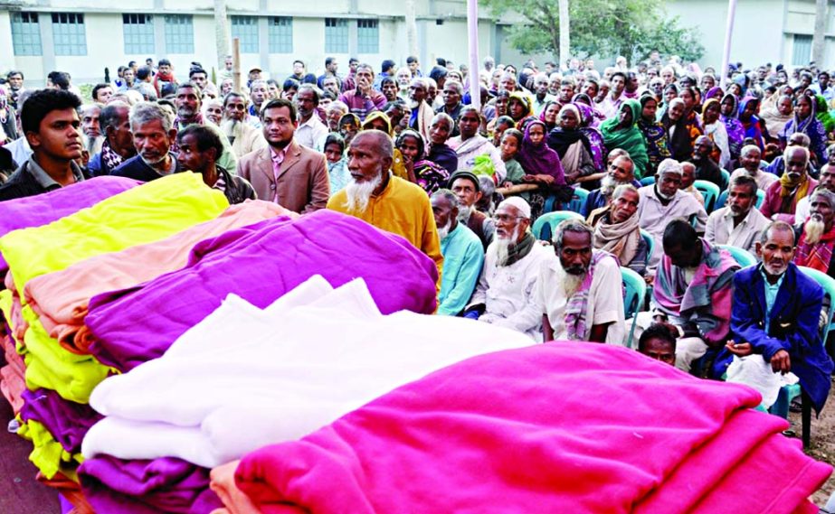 DINAJPUR: Protasha, an NGO distributing winter clothes among the cold -hit people in Fulbari Upazila on Tuesday.