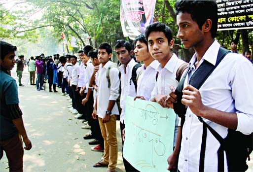 Students formed human chain near Gulshan office of Khaleda Zia demanding withdrawal of hartal and blockade and requesting her to think over their future. This photo was taken on Wednesday.