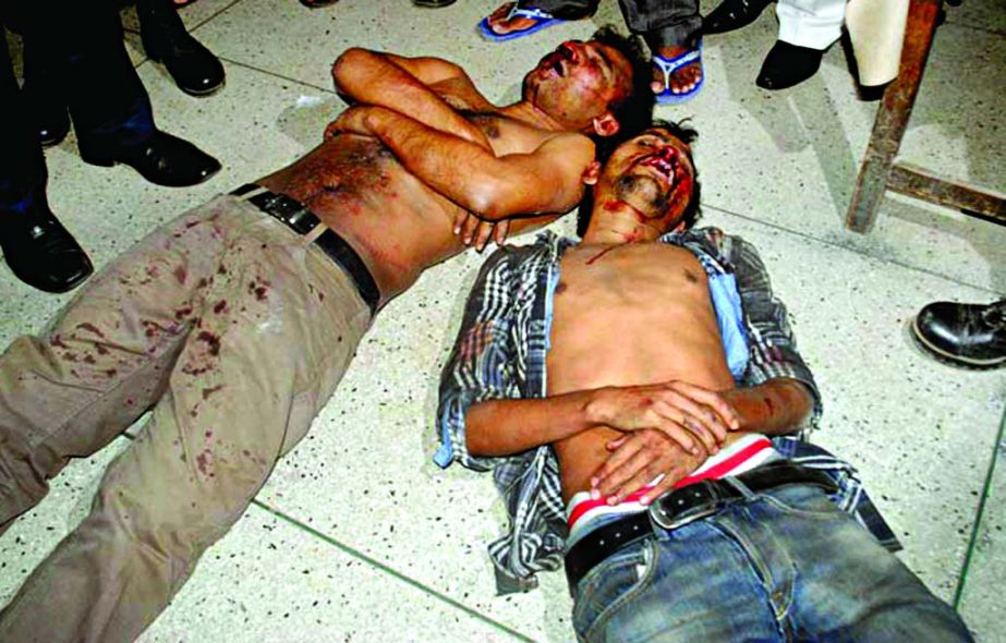 Two arson attackers lying on the street as they were beaten seriously by the public and later handed over to police at Chawkbazar area in city on Wednesday.
