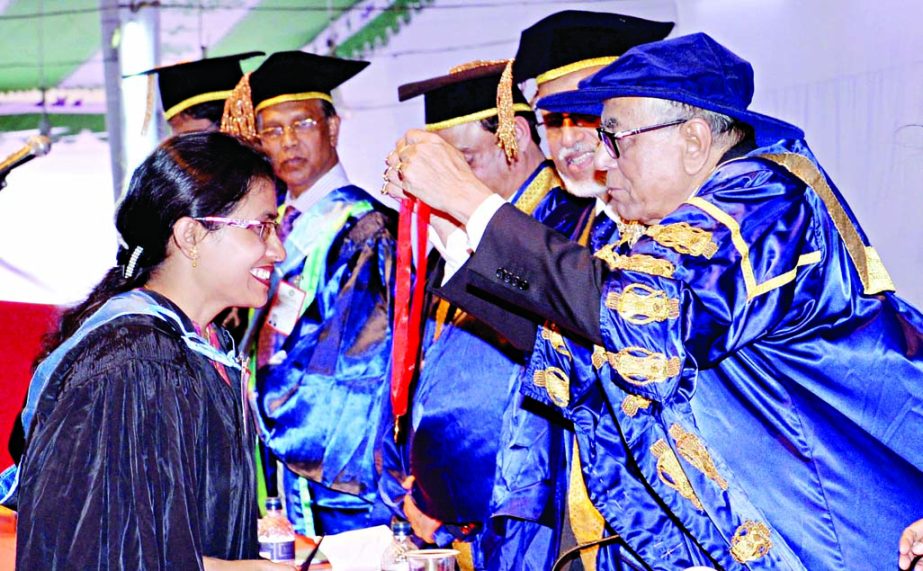 President Abdul Hamid presenting gold medals among the meritorious graduate students in the 5th convocation of Jahangirnagar University in Savar on Thursday.