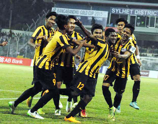 Players of Malaysia Football team celebrate after beating Singapore at the Sylhet District Stadium on Thursday.