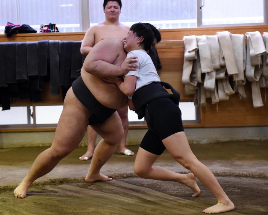 Female sumo wrestler Shiori Kanehira, one of a small but growing band of women grapplers, practices with a teammate during a training session in Tokyo.