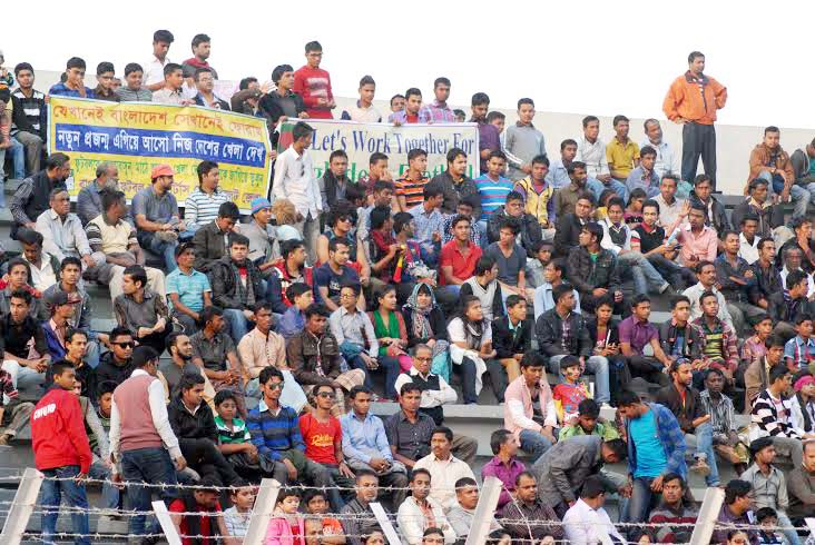 A large number of football fans enjoying the 1st simifinal match between Malaysia and Singapore at the Sylhet District Stadium on Thursday.